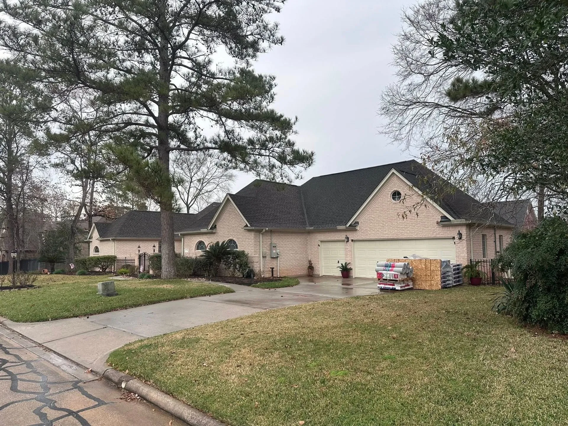 Detached single-family home with a dark shingle roof